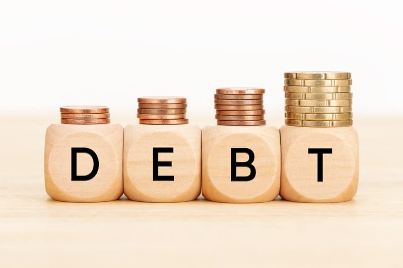 debt concept wooden blocks with text and coins on 2021 08 30 06 39 01 utc